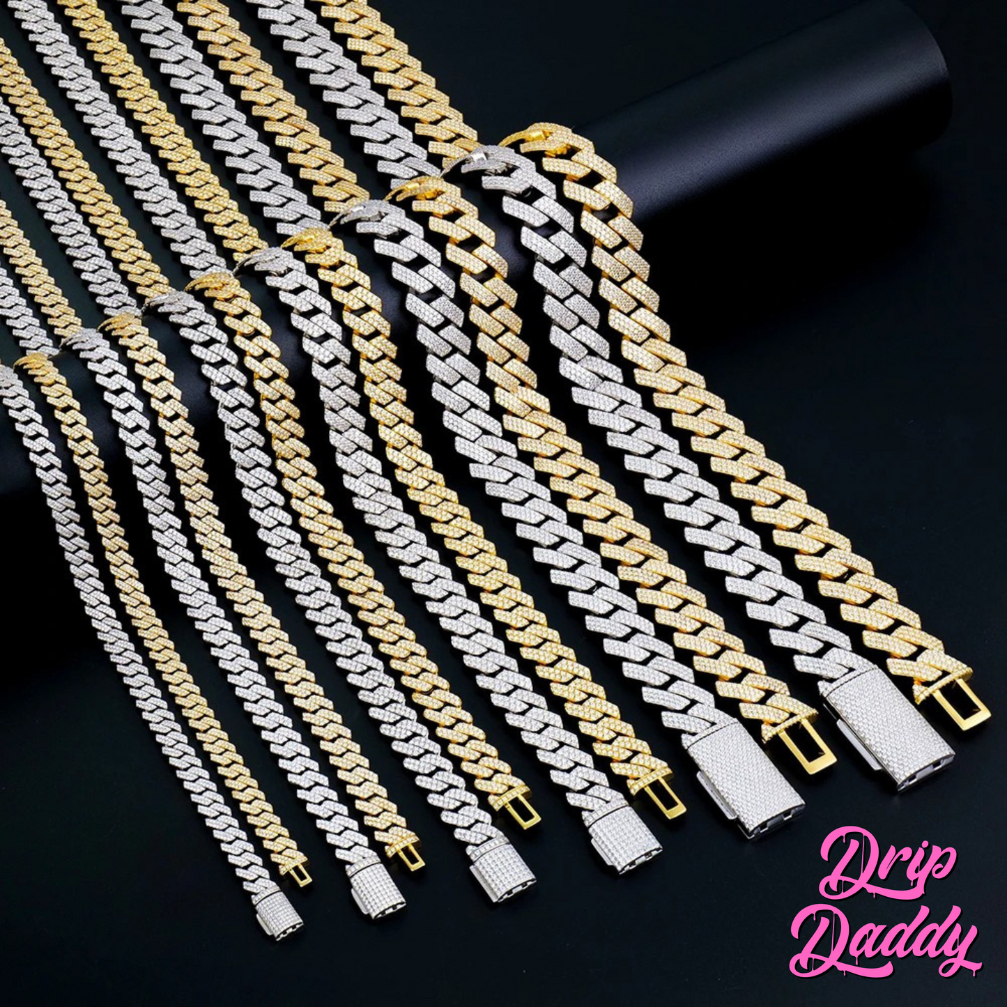 Several Drip Daddy Moissanite Cuban Link Chains (8mm–18mm, white & yellow gold plated) are arranged in parallel rows on a black surface, with the Drip Daddy logo in pink script at the bottom right.