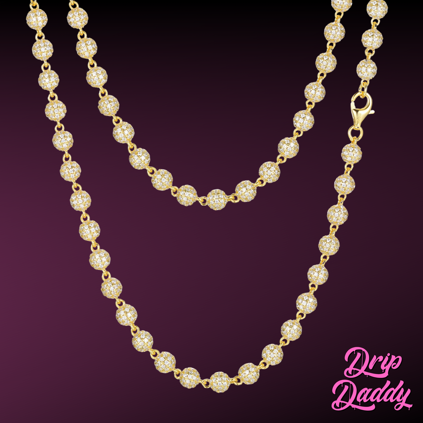 Close-up of Drip Daddy’s Ice Orbit 5mm to 10mm moissanite chain in yellow gold plated finish, displayed against a gradient dark-to-light purple background, with the Drip Daddy logo in pink at the bottom right corner.