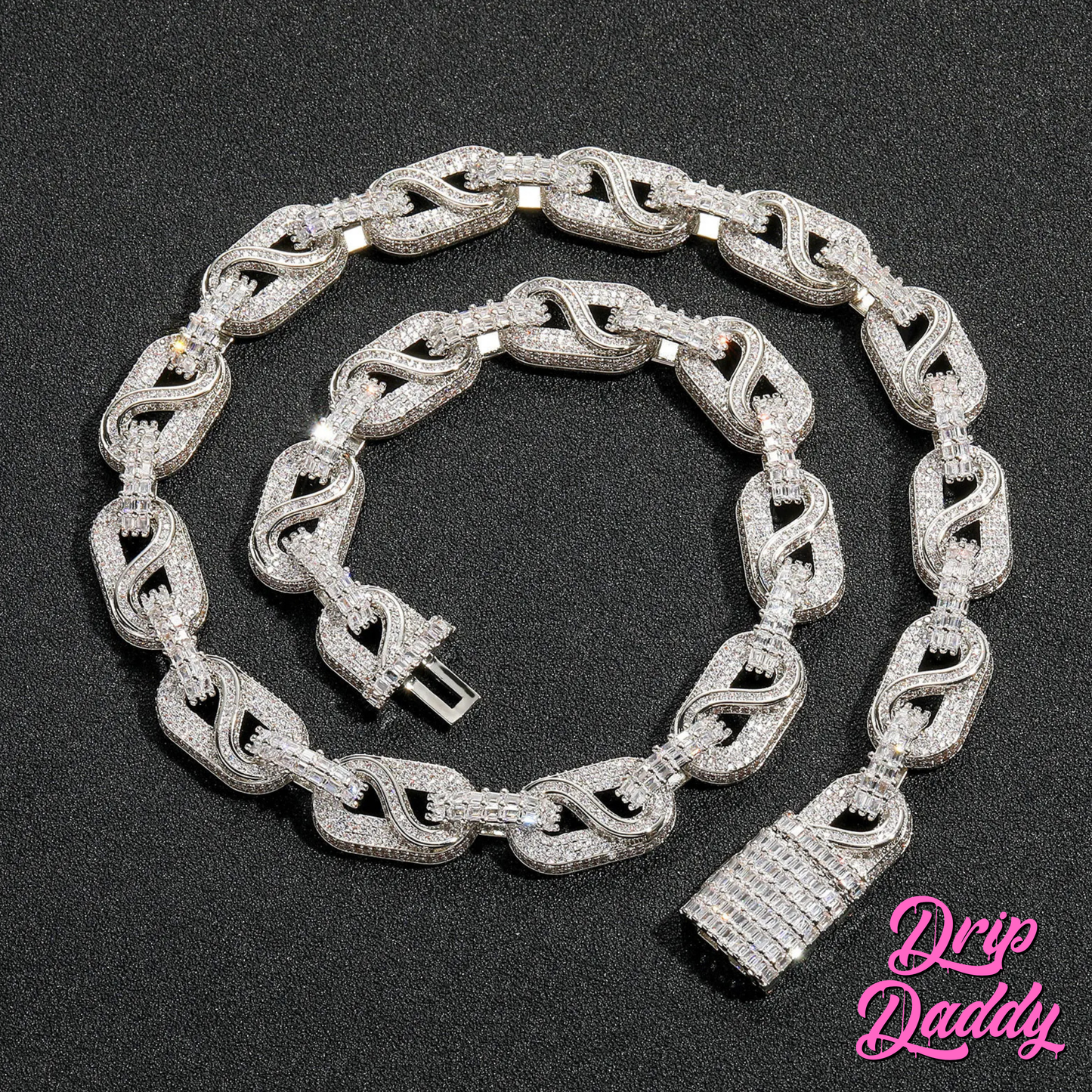 The Snowdrift – 14mm Baguette & Round Moissanite Link Chain by Drip Daddy, fully iced with white moissanite stones and a square clasp, coiled on a black surface.
