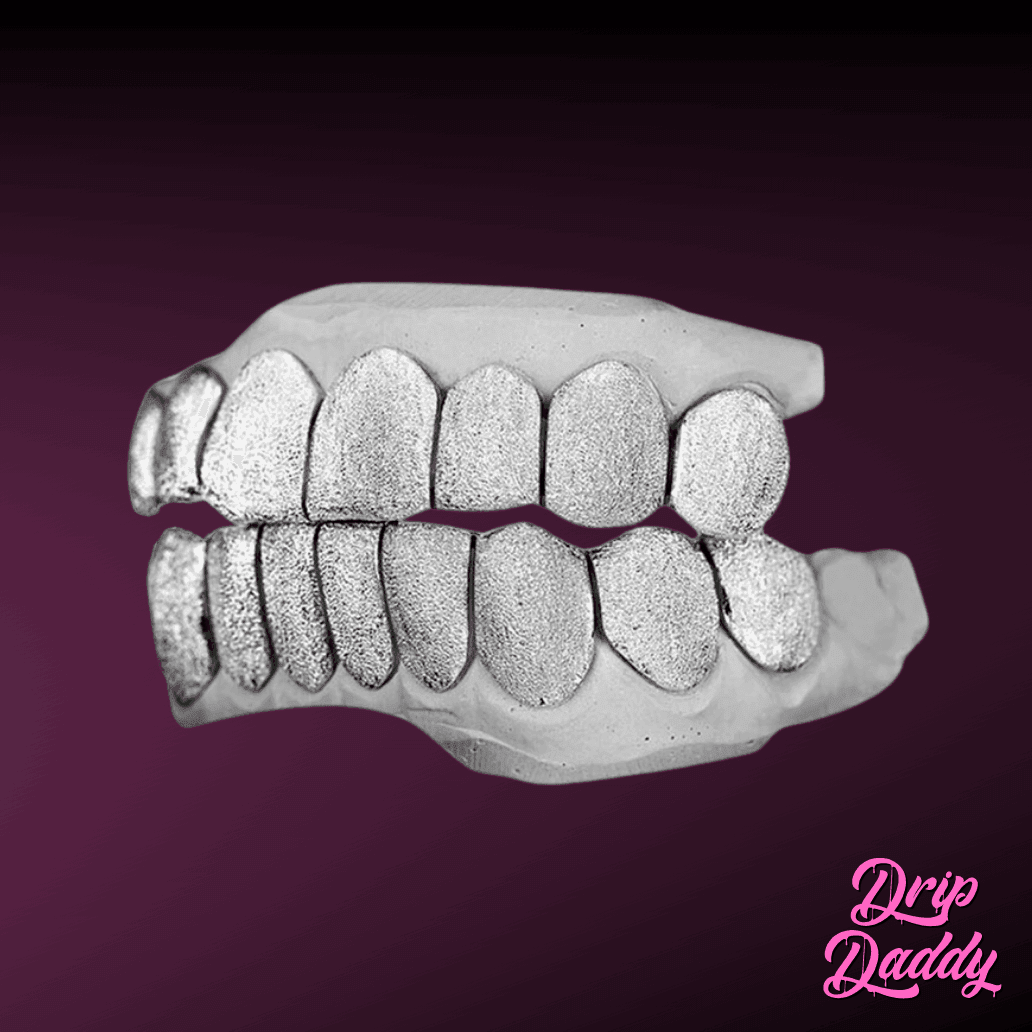Custom diamond dust grillz set crafted in 925 sterling silver, featuring full top and bottom teeth with shimmering texture, by Drip Daddy.