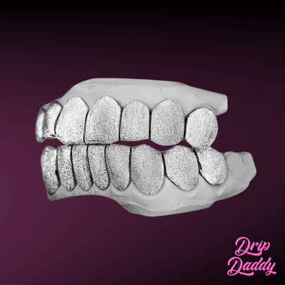 Custom diamond dust grillz set crafted in 925 sterling silver, featuring full top and bottom teeth with shimmering texture, by Drip Daddy.