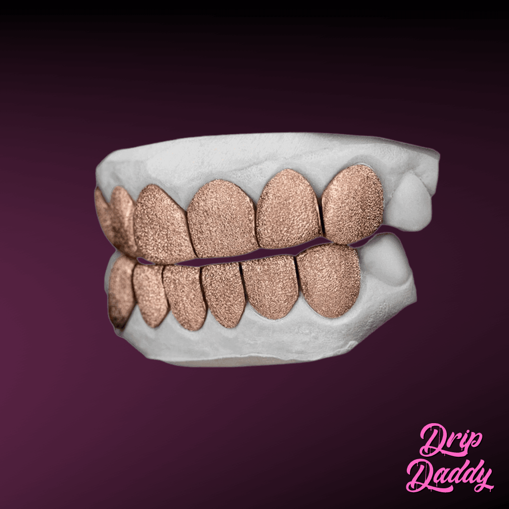 Custom rose gold diamond dust grillz made with 925 sterling silver base, angled side view showing full top and bottom set, by Drip Daddy.