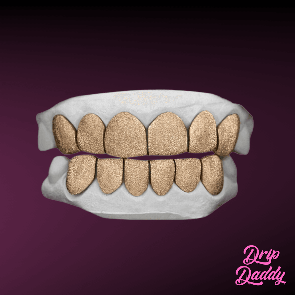 Custom yellow gold diamond dust grillz, covering both upper and lower teeth with textured finish on sterling silver base by Drip Daddy.