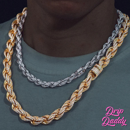 A person wearing Drip Daddy’s Avalanche Rope chains in yellow gold plated and white gold plated moissanite, styled together over a dark shirt, with the Drip Daddy logo in pink at the bottom right.