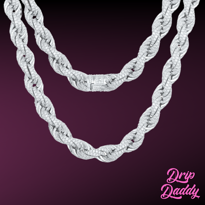 Close-up of Drip Daddy’s Avalanche Rope chain in white gold plated with moissanite stones, shown against a dark purple background with the Drip Daddy logo in pink at the bottom right.