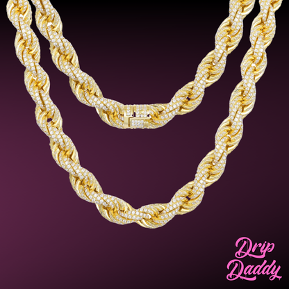 Close-up of Drip Daddy’s Avalanche Rope chain in yellow gold plated with moissanite stones, shown against a dark purple background with the Drip Daddy logo in pink at the bottom right.