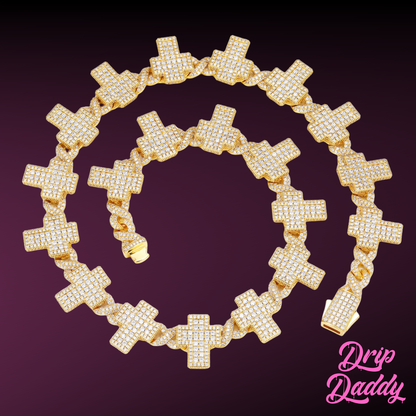 Display shot of Drip Daddy’s Crucifix Link – 8mm Moissanite Chain in yellow gold plating, arranged in a circular set to highlight the iced crucifix links and box clasp against a gradient purple background, with the pink Drip Daddy logo in the bottom right corner.