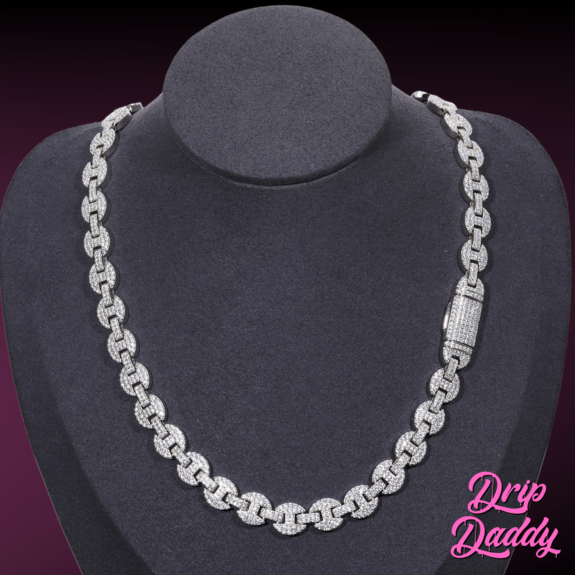A mannequin wearing Drip Daddy’s Gemlock Link chain in 6mm to 10mm size, crafted in white gold plating with moissanite stones, shown with the clasp visible on the right side, against a dark gradient background with the Drip Daddy logo in pink at the bottom right.