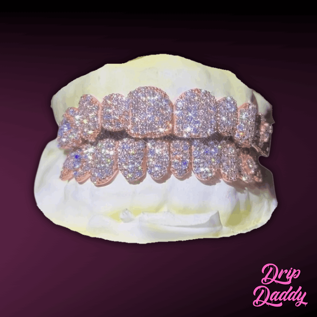 Custom iced out grillz by Drip Daddy, crafted in 925 sterling silver with rose gold plating and encrusted with moissanite stones. Luxury diamond-like brilliance, displayed on a dental mold with a dark gradient background.