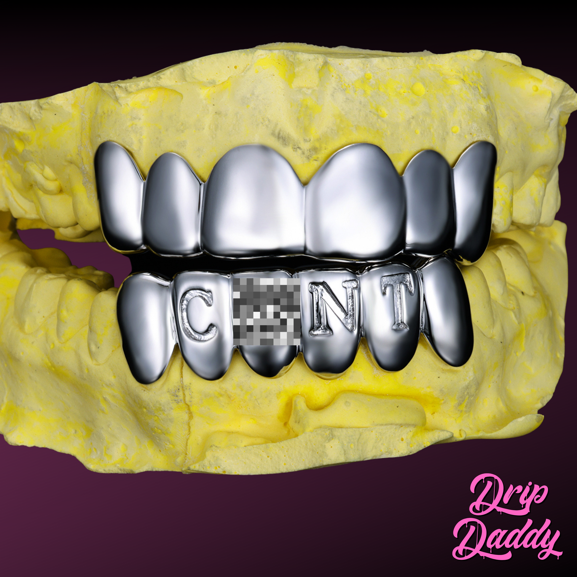 Custom silver engraved letter grillz by Drip Daddy, displayed on a yellow dental mold. The lower teeth spell out a censored word with one letter pixelated. Unique silver grillz design shown against a purple background with Drip Daddy branding.