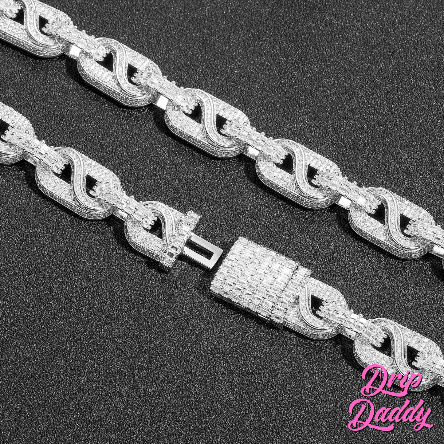 Close-up of The Snowdrift – 14mm Baguette & Round Moissanite Link Chain by Drip Daddy, featuring iced-out links and a jeweled clasp, shown on a black background.