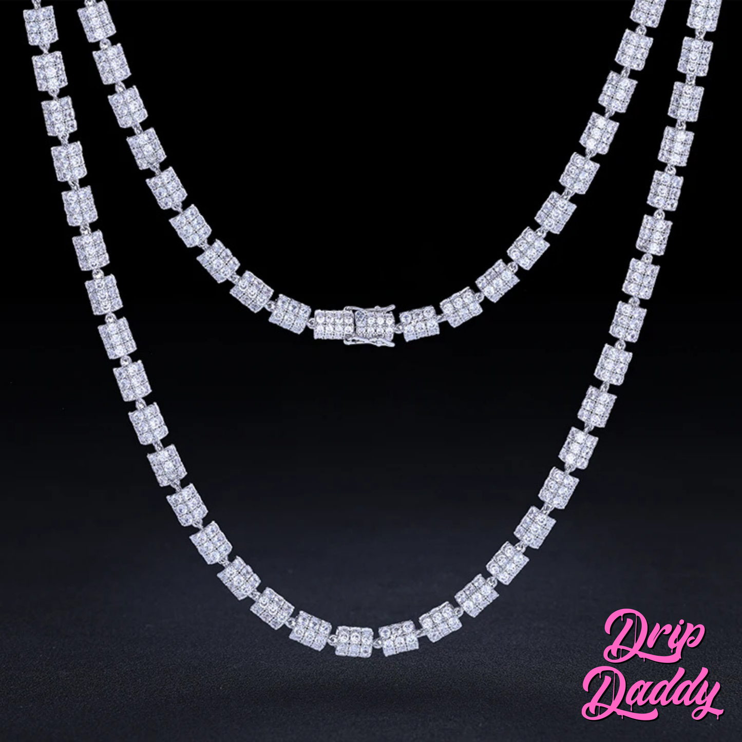 Close-up of Drip Daddy’s Stargazer Cylinder – 7mm Moissanite Chain in white and yellow gold plating, displayed in two layered lengths against a black background, with the Drip Daddy logo visible in pink at the bottom right corner.