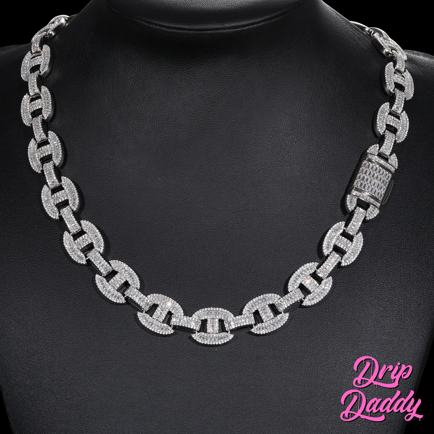 The Drip Daddy G-Link – 16mm Baguette Moissanite Chain is displayed on a black mannequin bust, showing its full white gold design with a fully iced clasp. The Drip Daddy logo appears in pink at the lower right corner.