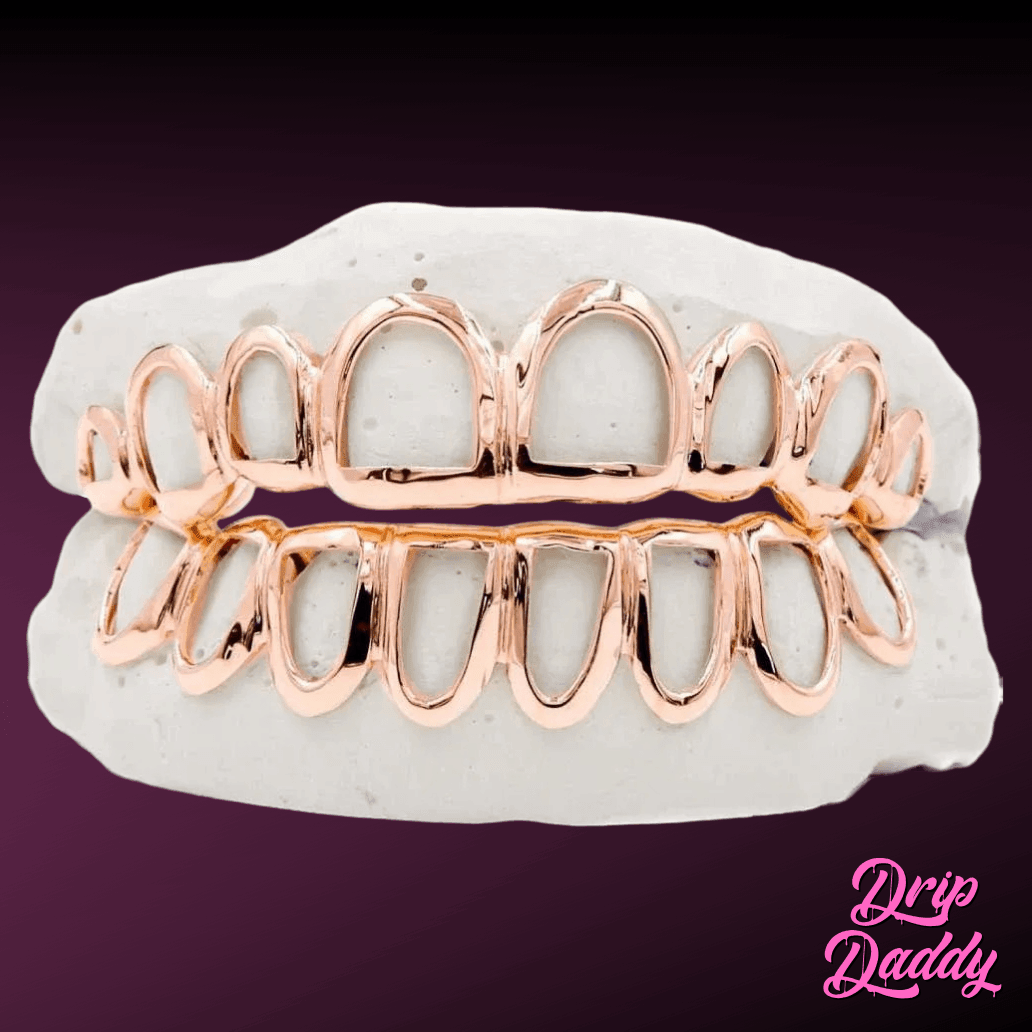 Custom Open Face Window Grillz in rose-gold plating on 925 sterling silver, full upper and lower set on a dental mold, displayed on a purple gradient background with Drip Daddy branding.