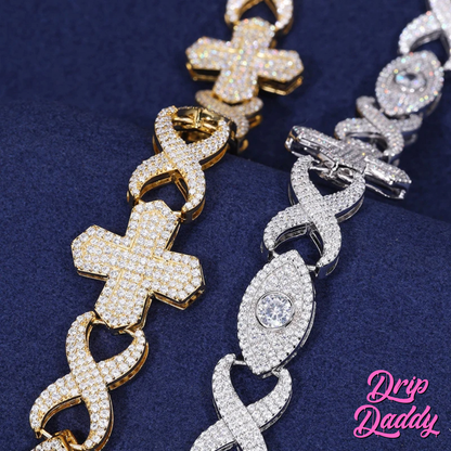 Side-by-side display of two Drip Daddy Evil Eye Cross Link – 12mm Moissanite Chains, one in yellow gold and one in white gold, showcasing diamond-like brilliance of the moissanite stones.