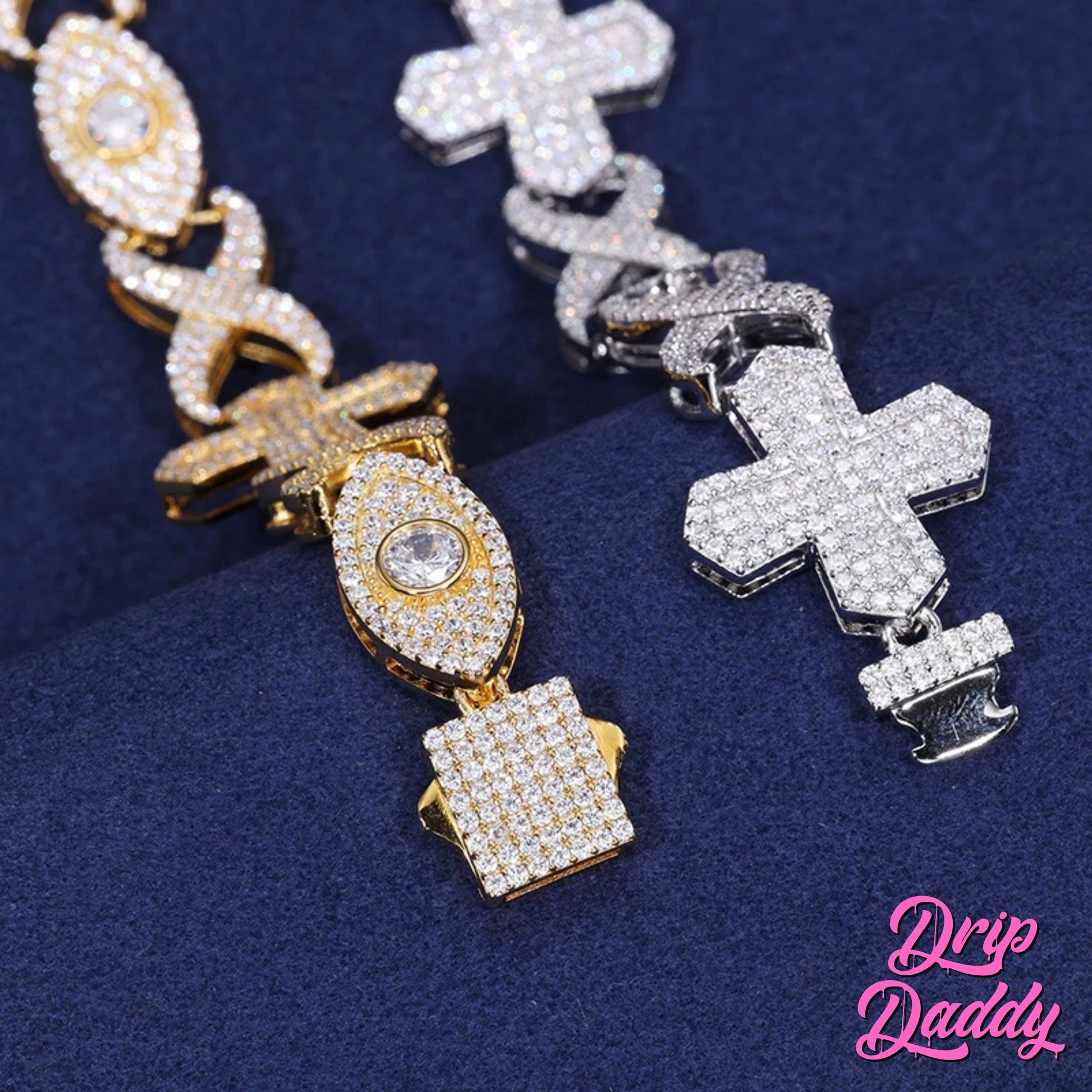 Close-up of the Drip Daddy Evil Eye Cross Link – 12mm Moissanite Chain in yellow gold and sterling silver, with detailed moissanite-encrusted crosses and eye links, shown on dark blue fabric.