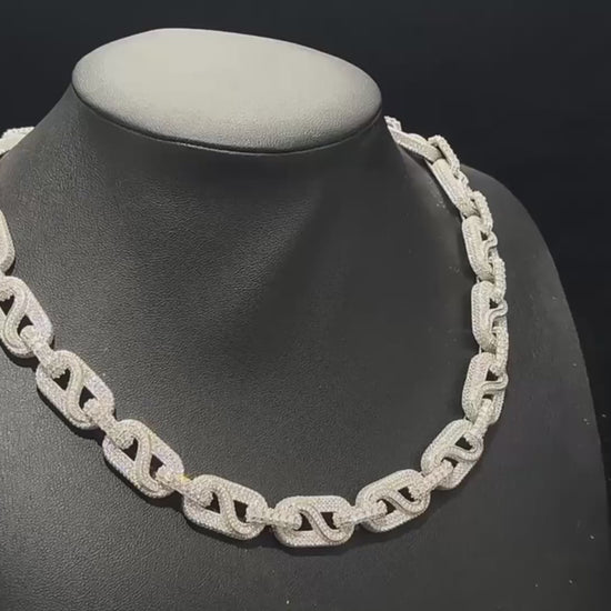 A cinematic showcase of The Snowdrift – 14mm Baguette & Round Moissanite Link Chain by Drip Daddy. The iced-out chain sparkles under studio lighting, highlighting baguette and round moissanite stones with a secure clasp.