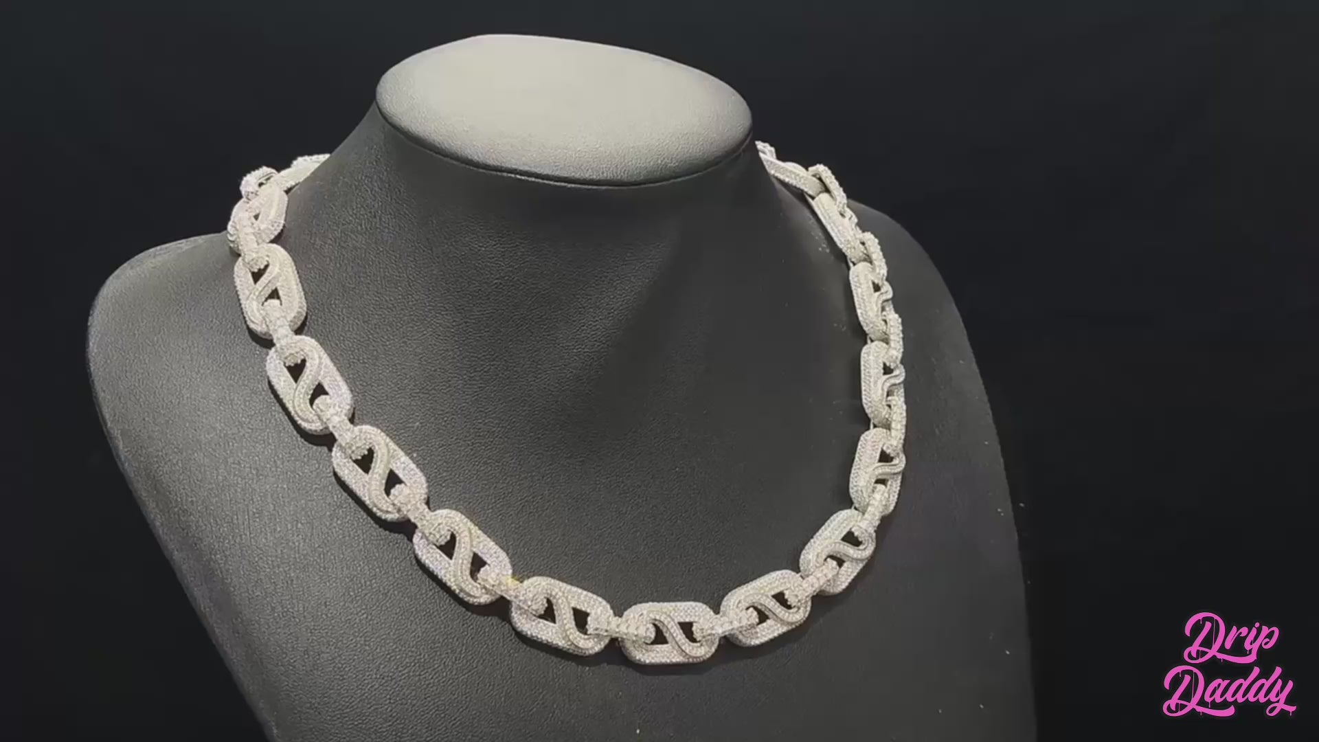 A cinematic showcase of The Snowdrift – 14mm Baguette & Round Moissanite Link Chain by Drip Daddy. The iced-out chain sparkles under studio lighting, highlighting baguette and round moissanite stones with a secure clasp.