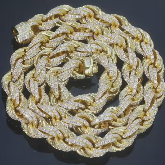Close-up video of Drip Daddy’s Avalanche Rope – 8mm to 14mm Moissanite Rope Chain in yellow gold and white gold plating, slowly rotating under studio lighting to highlight the detailed rope design and iced-out moissanite stones. The chains shimmer as the camera pans smoothly, emphasizing their luxurious shine and texture. The Drip Daddy logo in pink is visible in the corner throughout the video.