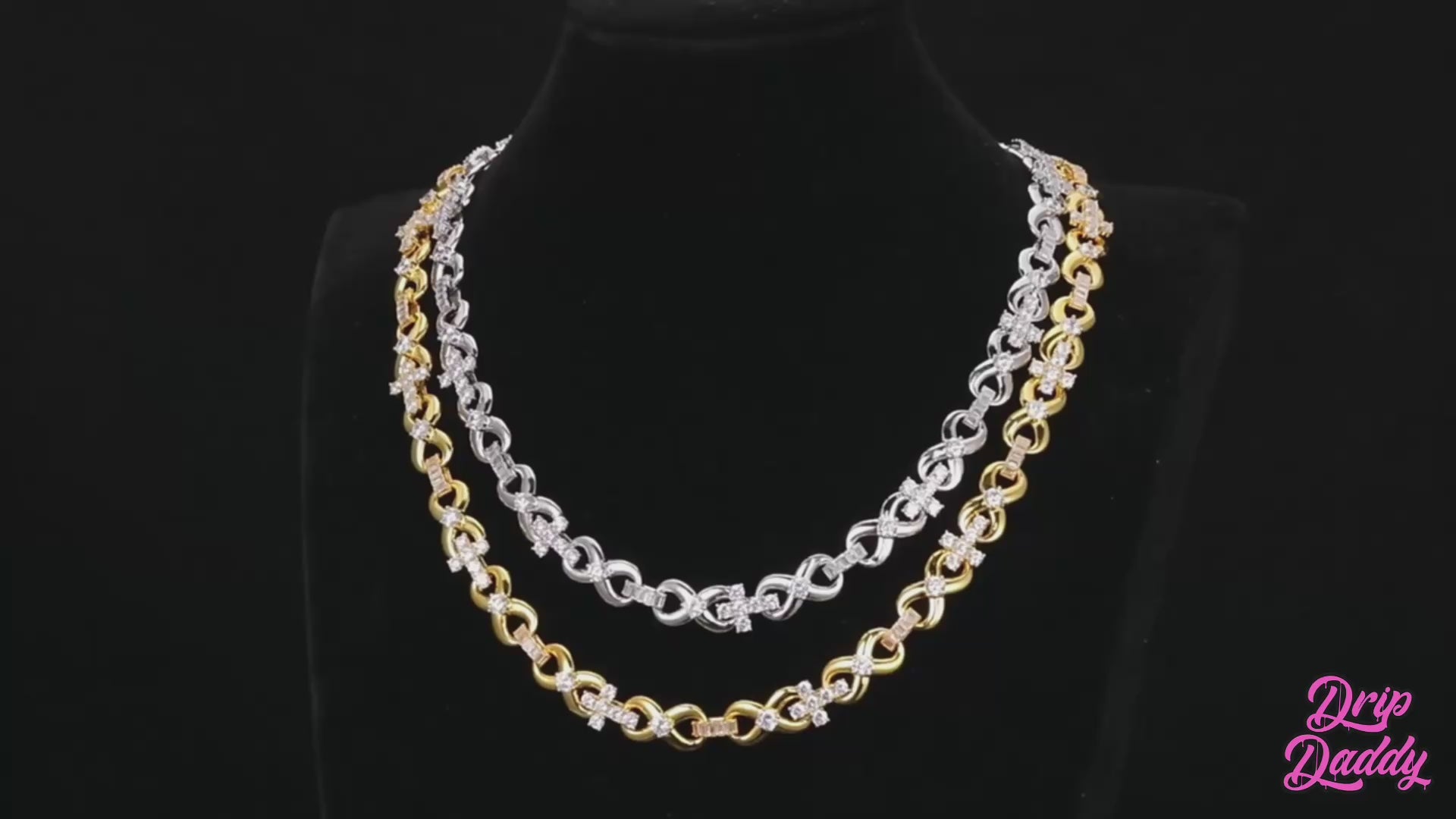 A studio-lit video showcasing Drip Daddy’s The Infinity Cross Plain Chain. The camera pans across the chain, highlighting its polished finish and clean design against a dark background, with the Drip Daddy logo visible in the corner.