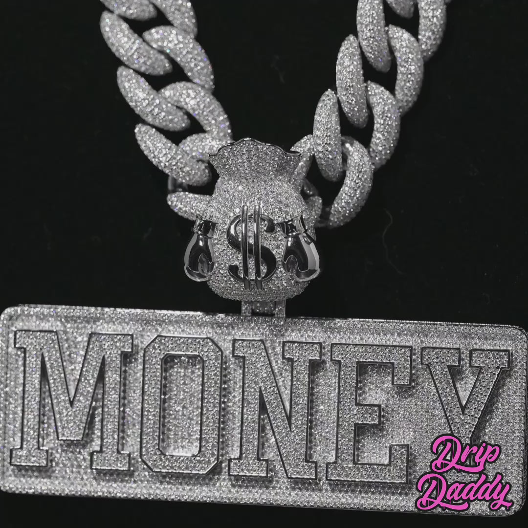 Rotating video of a custom MONEY pendant with moissanite stones set in sterling silver and white gold plating, designed for luxury streetwear jewelry style.