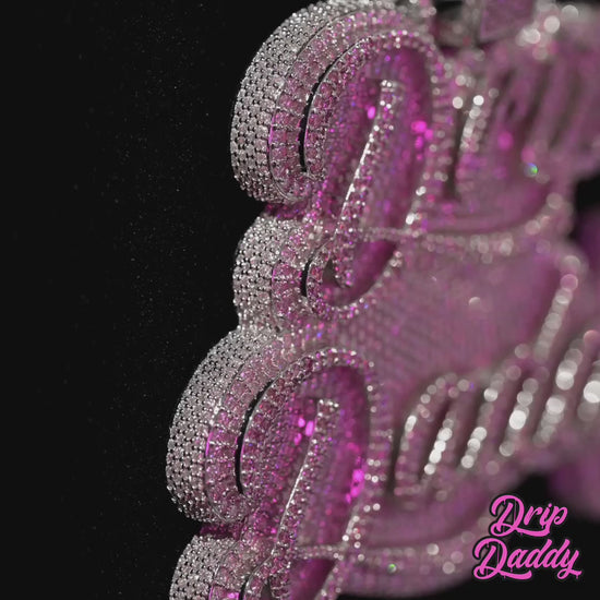 Close-up video of a custom Drip Daddy pendant in 925 sterling silver with white gold plating and moissanite stones, showcasing luxury custom jewelry design.