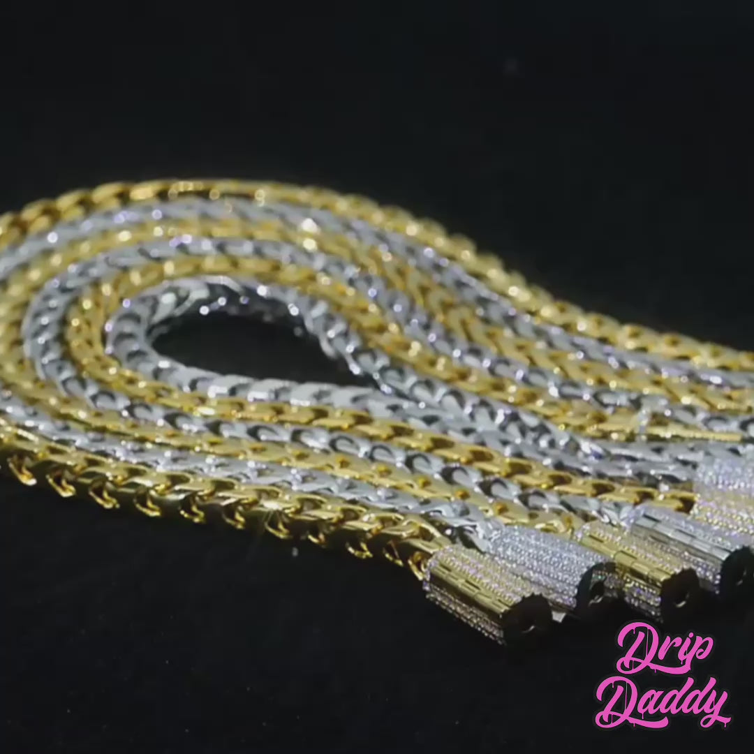 Close-up video of the Franco Flex chain in polished sterling silver, featuring a sleek 4mm Franco link design with an iced-out clasp set with moissanite stones. The video pans across the chain, highlighting its flexible structure, clean finish, and the shimmering sparkle of the fully iced clasp.