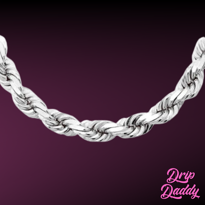 Close-up of the Drip Daddy Classic Rope Chain (3mm–12mm, white, yellow & rose gold plated) on a dark purple gradient background, with “Drip Daddy” in pink script in the lower right corner.